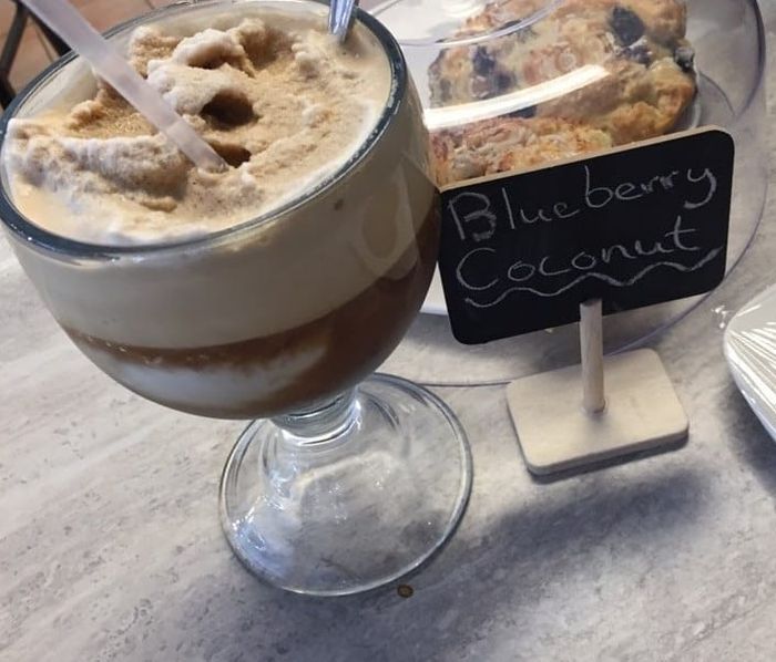 Iced coffee dessert drink topped with cinnamon